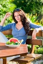 Garden terrace beautiful woman fresh summer melon Royalty Free Stock Photo