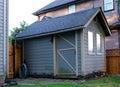 Garden and Tool Shed in Yard Near Flowers and Grass tool shed Royalty Free Stock Photo