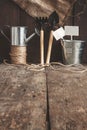 Garden tool, shovel, rake, watering can, bucket, bag on a wooden Royalty Free Stock Photo