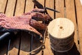 Garden tools with gloves, rake and cord on a table Royalty Free Stock Photo