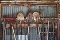 Garden tools hanging in a row in a shed Royalty Free Stock Photo