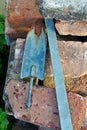 Garden tools vintage spade shovel resting on antique bricks