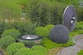 GARDEN WITH TOPIARY AND MODERN PEBBLE DECORATIVE CREATIONS