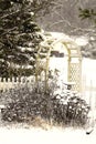 Garden with trellis in midst of snowstorm