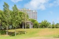 Garden of Troia covered with green trees near apartment complexes, Grandola municipality, Portugal