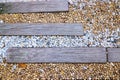 Garden walk. sea stone with pathways made of Timber Royalty Free Stock Photo