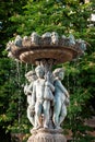 Garden water fountain with statues of little boys. Paris, France. Royalty Free Stock Photo