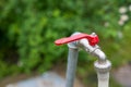 Garden water tap with plastic hose close up shot Royalty Free Stock Photo