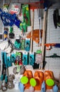 Garden watering cans for sale in a hardware store on a sales shelf and garden shears weigh Belarus, Minsk, January 26, 2021