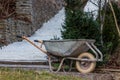 Garden-wheelbarrow filled with soil on a farm Royalty Free Stock Photo