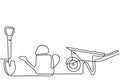 Garden wheelbarrow, watering can, and shovel in continuous one line drawing. Farmer equipment isolated on white background.