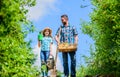 Garden works. Spring garden. Spring gardening checklist. Father and daughter with shovel and watering can in garden. It Royalty Free Stock Photo