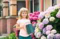 Garden works. Spring gardening. Kid with watering can in garden. Plant and care flowers. Royalty Free Stock Photo