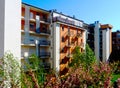 Garden scene with blooming pink cherry tees. condo building beyond Royalty Free Stock Photo