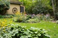 Garden with yellow shed and lawn