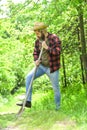 Gardener agricultural worker with garden tools. Caucasian farmer countryside nature background. Tools for gardening Royalty Free Stock Photo