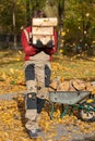 Gardener carring logs Royalty Free Stock Photo