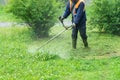 The gardener cutting grass by lawn mower Royalty Free Stock Photo