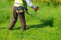 The gardener cutting grass by lawn mower, lawn care Royalty Free Stock Photo