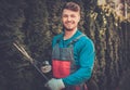 Gardener cutting trees with clippers Royalty Free Stock Photo