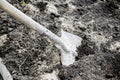 Gardener digging in vegetable garden with shovel. Farmer working with spade dig black soil, ground, lawn.farmland, agriculture. Royalty Free Stock Photo