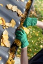 Gardener fixing rain gutter Royalty Free Stock Photo