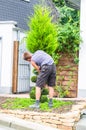 Gardener with a hedge trimmer