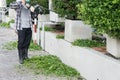 Gardener with his gasoline hedge trimmer in action Royalty Free Stock Photo