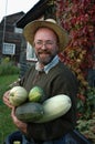 Gardener holding large marrows