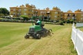 Gardener in lawn mower, maintenance service of the gardens in Costa Ballena resort, Rota, province of Cadiz, Spain