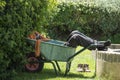 Man sleeping in wheelbarrow, gardener resting in shadow. Gardener resting in wheelbarrow Royalty Free Stock Photo