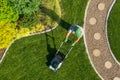 Gardener Mowing Backyard Garden Grass Aerial View