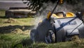 Gardener Operating Soil Aeration Machine on Grass Lawn Royalty Free Stock Photo