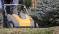 Gardener Operating Soil Aeration Machine on Grass Lawn Royalty Free Stock Photo