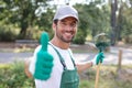 gardener with rake in garden Royalty Free Stock Photo