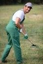 gardener with rake at work Royalty Free Stock Photo