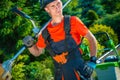 Gardener with Shoulder Mower