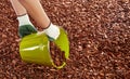 Gardener spreading wood chip mulch