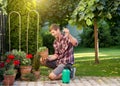 Man taking care of plants in garden Royalty Free Stock Photo