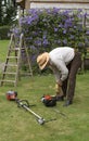 Gardener with tools to cut a hedge Royalty Free Stock Photo