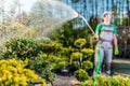 Gardener Watering Plants