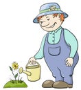 Gardener waters a flower