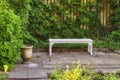 Gardeners corner. Private chair in green garden in the beautiful outdoors. A place with green nature views outside