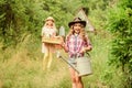 Gardeners at work. child hold gardening tools. small girl farmer with shovel and watering can. happy farming. spring