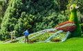 Gardeners working at the flower bird on Flower Island Mainau, a unique Island of Flower, Lake Constance, Germany
