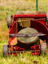 Broken old lawnmower in backyard grass Royalty Free Stock Photo