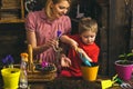 Gardening concept. Little child help mother planting flower in pot with gardening tool. Organic gardening. Gardening is