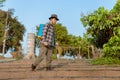 Gardening concept a young male farmer spraying a chemical pesticide for preventing the crops from the pests