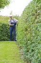 Gardening, cutting hedge Royalty Free Stock Photo