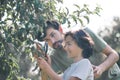 Dad teaching his son to cut branches with secator Royalty Free Stock Photo